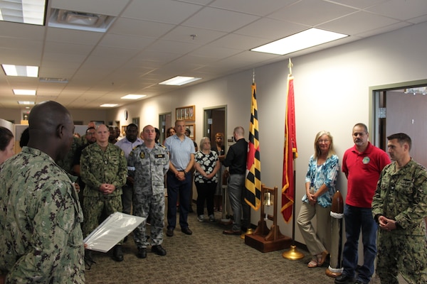 Lt. Cmdr. Fred Nti, NMRLC Detachment Fort Detrick Officer in Charge, reads one of the MSC leadership letters celebrating the MSC 77th birthday.