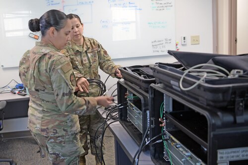 Airmen working on machine