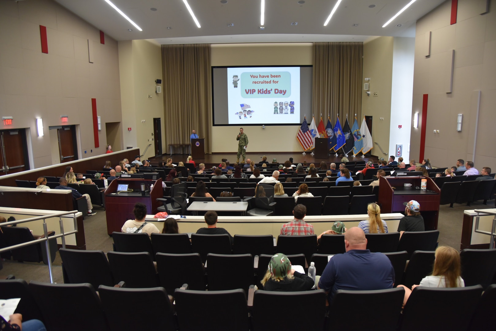 Navy officer in auditorium.