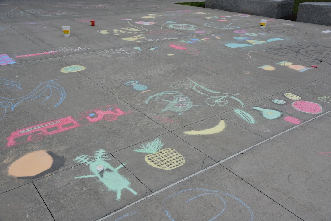 Pictures on sidewalk.