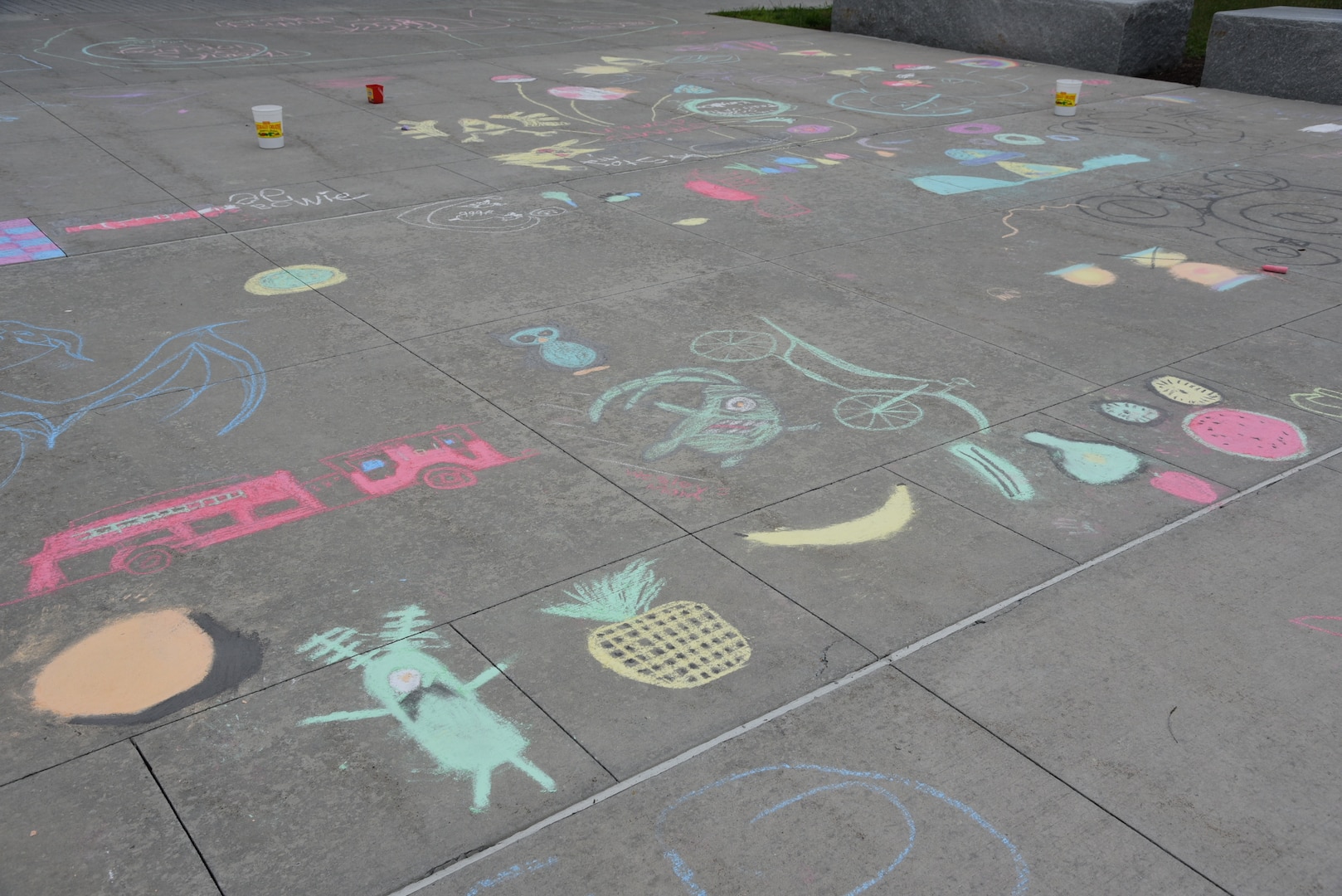 Pictures on sidewalk.