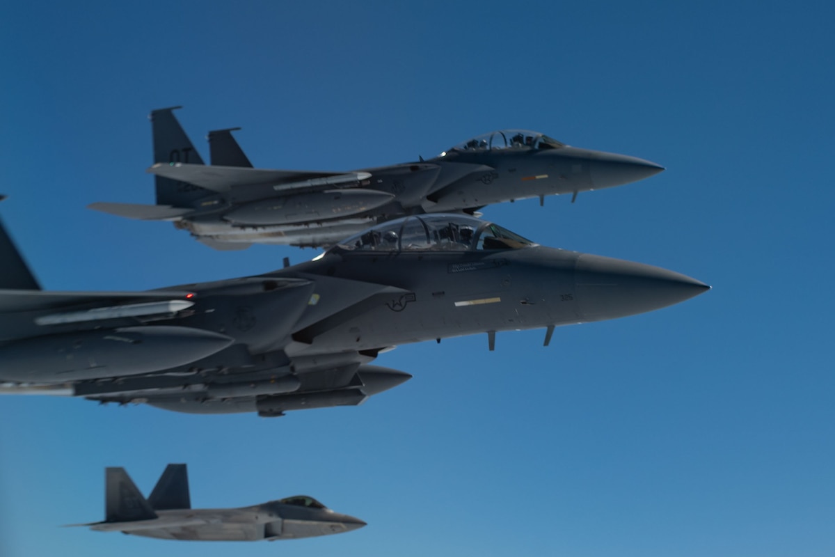 Two F-15s and one F-22 flying