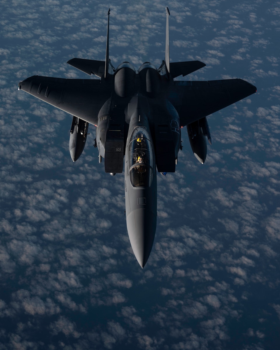 F-15E flying over the ocean