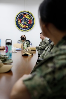 SINGAPORE (July 24, 2024) Capt. Franca Jones, commander, Naval Medical Research Command visits with staff from Naval Medical Research Unit (NAMRU) INDO PACIFIC during an official site visit. NAMRU INDO PACIFIC, part of the Naval Medical Research & Development enterprise and headquartered out of Singapore, conducts research in cooperation with host nations in Vietnam, Laos, Singapore, Malaysia and Thailand to improve global health, ensure military force health protection and address infectious diseases such as malaria, dengue fever virus and gastro-intestinal pathogens. (U.S. Navy photo by Tommy Lamkin /Released)