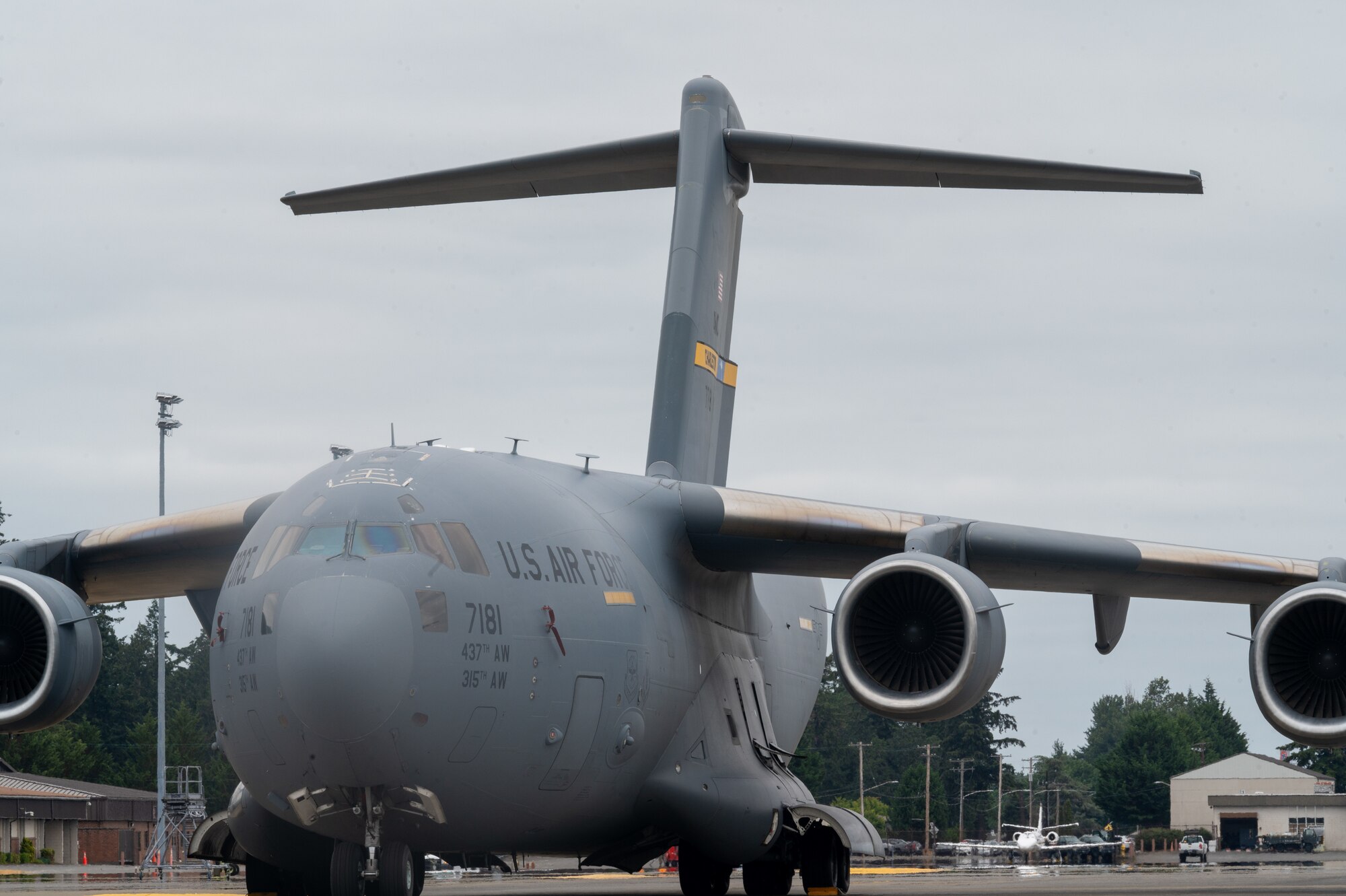 A U.S. Air Force C-17 Globemaster III from Joint Base Charleston, S.C., and another from Joint Base Lewis-McChord, Washington, are parked next to each other on the flightline, Aug. 8, 2024
