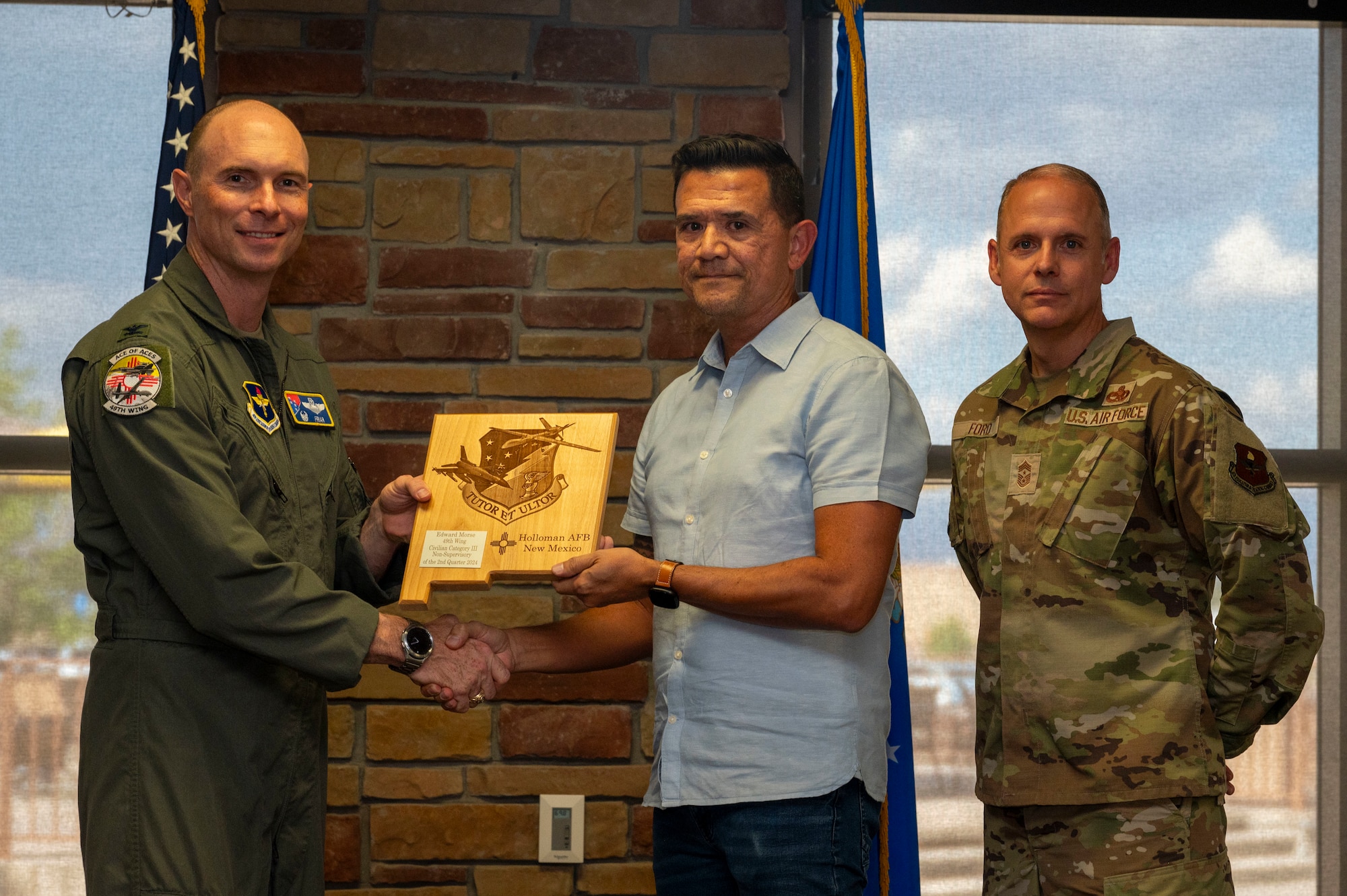 Edward Morse from the 54th Fighter Group, receives the Civilian Category III Non-supervisory of the 2nd Quarter award during the 49th Wing’s 2nd Quarter Award ceremony at Holloman Air Force Base, New Mexico, Aug. 9, 2024. Quarterly award winners were selected based on their technical expertise, demonstration of leadership and job performance. (U.S. Air Force photo by Senior Airman Isaiah Pedrazzini)