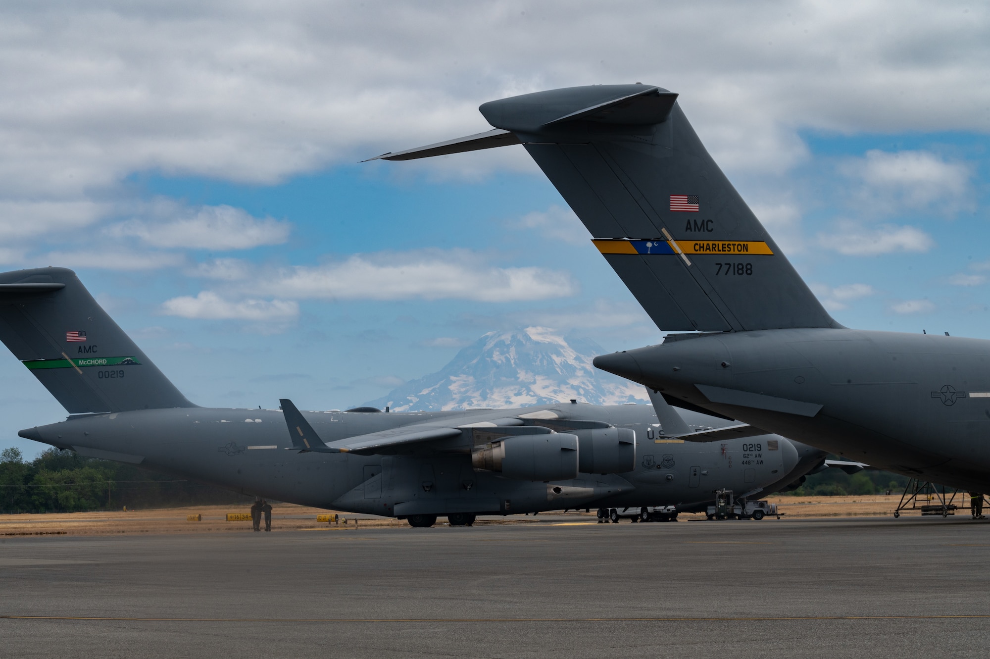 A U.S. Air Force C-17 Globemaster III from Joint Base Charleston, S.C., and another from Joint Base Lewis-McChord, Washington, are parked next to each other on the flightline, Aug. 8, 2024