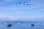 240809-N-VA915-1077 PACIFIC OCEAN (Aug. 9, 2024) Abraham Lincoln Carrier Strike Group and Cavour Carrier Strike Group sail in formation on Aug. 9. The United States Navy and the Italian Navy held the first-ever bilateral Multi-Large Deck Event (MLDE) in the Indo-Pacific. Abraham Lincoln, flagship of Carrier Strike Group Three, is underway conducting routine operations in the U.S. 7th Fleet area of operations. U.S. 7th Fleet is the U.S. Navy's largest forward-deployed numbered fleet, and routinely interacts and operates with allies and partners in preserving a free and open Indo-Pacific region. (U.S. Navy photo by Mass Communication Specialist 1st Class Jerome D. Johnson)