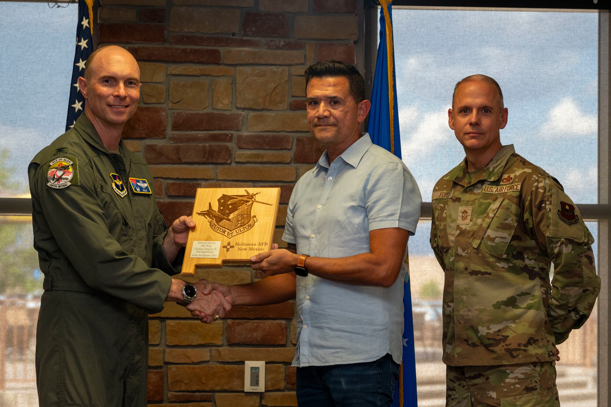 Edward Morse from the 54th Fighter Group, receives the Civilian Category III Non-supervisory of the 2nd Quarter award during the 49th Wing’s 2nd Quarter Award ceremony at Holloman Air Force Base, New Mexico, Aug. 9, 2024. Quarterly award winners were selected based on their technical expertise, demonstration of leadership and job performance. (U.S. Air Force photo by Senior Airman Isaiah Pedrazzini)