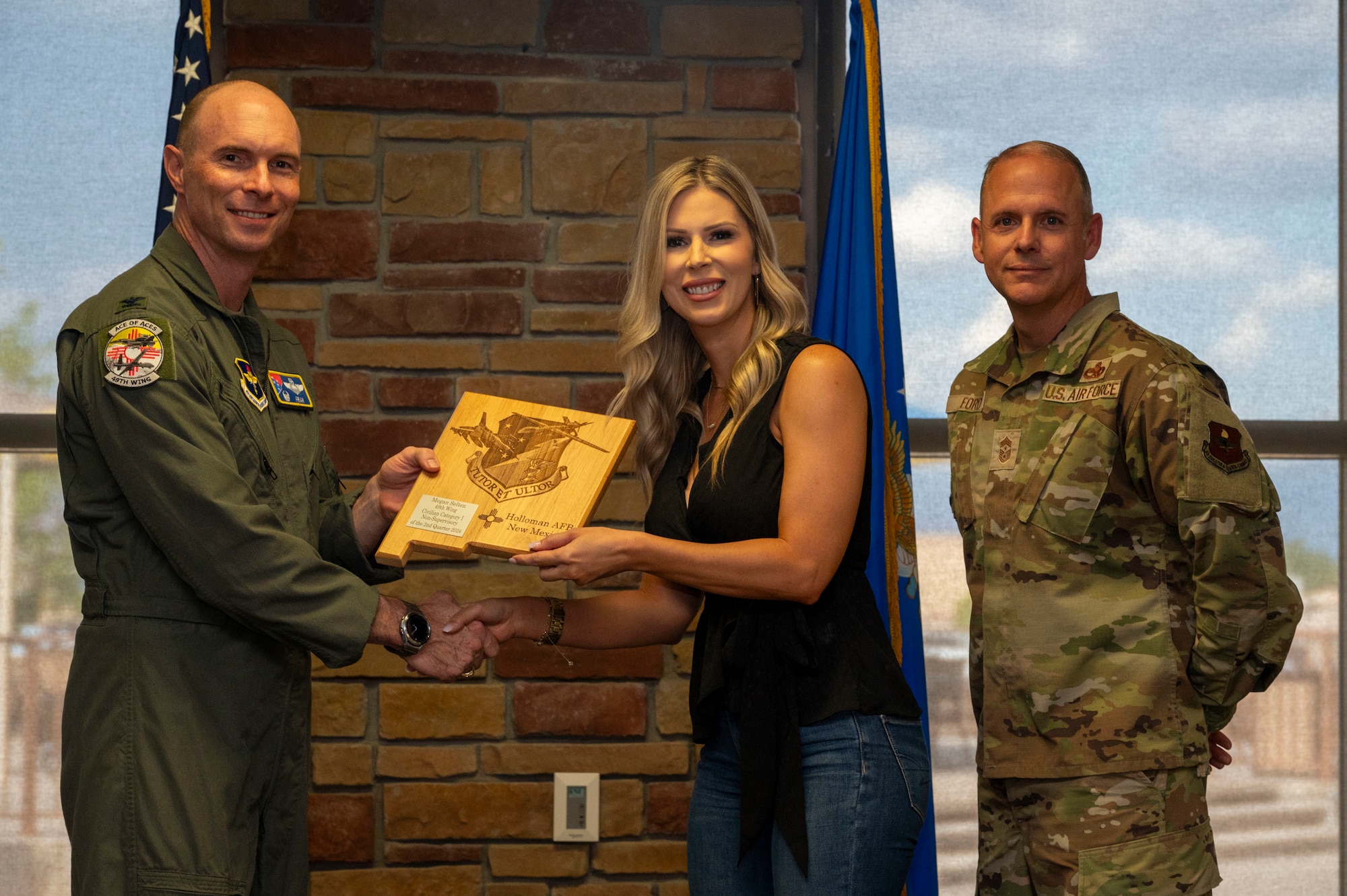 Megan Selton from the 49th Operations Group, receives the Civilian Category I Non-supervisory of the 2nd Quarter award during the 49th Wing’s 2nd Quarter Award ceremony at Holloman Air Force Base, New Mexico, Aug. 9, 2024. Quarterly award winners were selected based on their technical expertise, demonstration of leadership and job performance. (U.S. Air Force photo by Senior Airman Isaiah Pedrazzini)