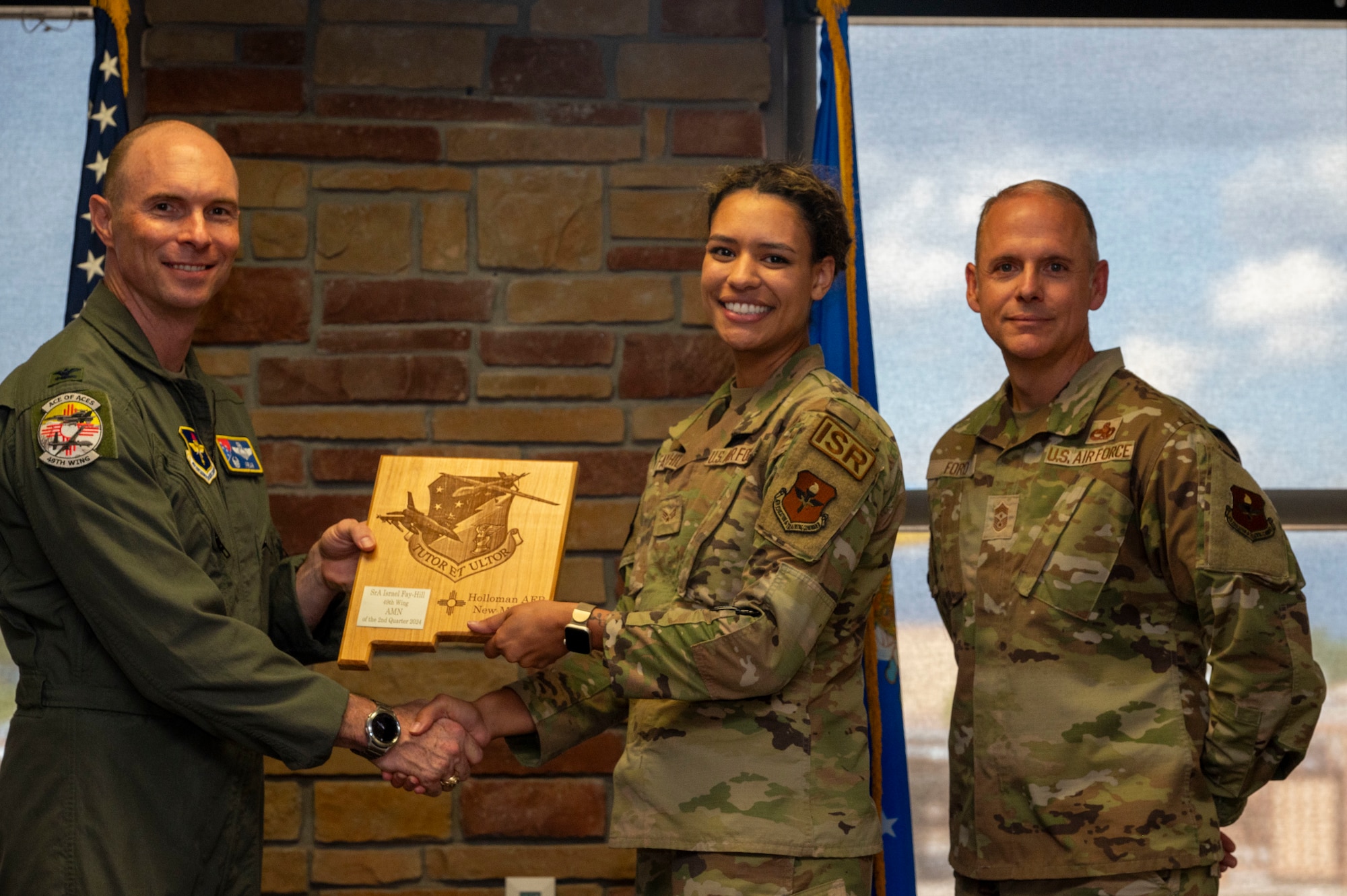 U.S. Air Force Senior Airman Israel Fay-Hill from the 54th Fighter Group, receives the Airman of the 2nd Quarter award during the 49th Wing’s 2nd Quarter Award ceremony at Holloman Air Force Base, New Mexico, Aug. 9, 2024. Quarterly award winners were selected based on their technical expertise, demonstration of leadership and job performance. (U.S. Air Force photo by Senior Airman Isaiah Pedrazzini)