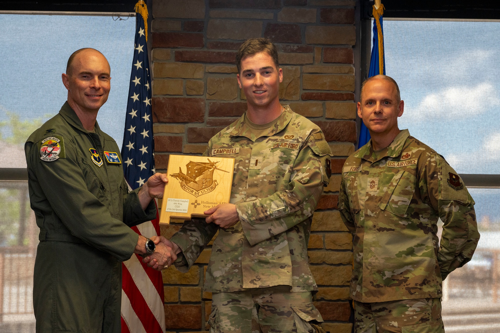 U.S. Air Force 2nd Lt. Patrick Campbell from the 49th Mission Support Group, receives the Company Grade Officer of the 2nd Quarter award during the 49th Wing’s 2nd Quarter Award ceremony at Holloman Air Force Base, New Mexico, Aug. 9, 2024. Quarterly award winners were selected based on their technical expertise, demonstration of leadership and job performance. (U.S. Air Force photo by Senior Airman Isaiah Pedrazzini)