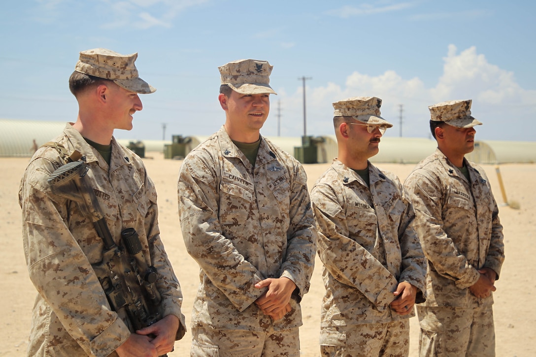 Servicemembers with 1st Battalion, 2d Marine Regiment, 2d MARDIV were awarded a Navy and Marine Corps Commendation Medal for rendering aid to a Marine during a live fire exercise, ultimately saving his life.