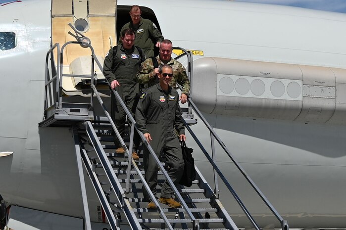 Air Combat Command leadership walks out of an E-3
