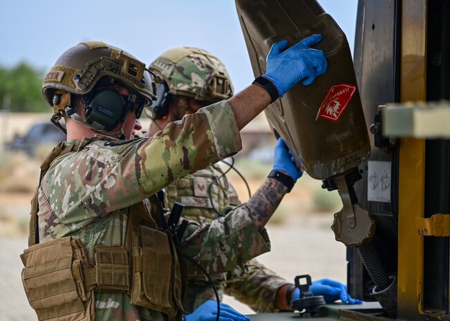 Airmen fueling forklift