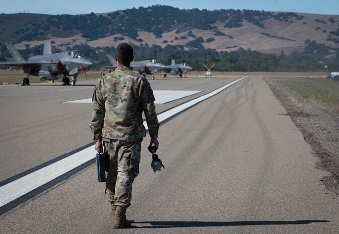 Maintainer walking on the flightline