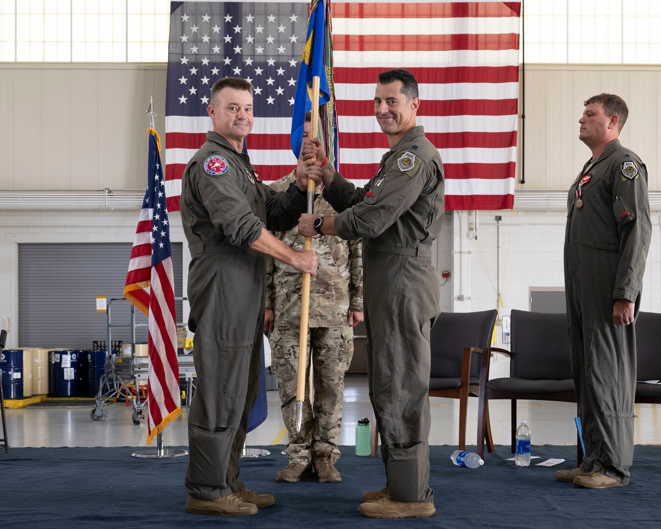 Col. Andrew M. Weidner, left, passes the 149th Fighter Squadron guidon to Lt. Col. Peter “Sly” Liggieri.