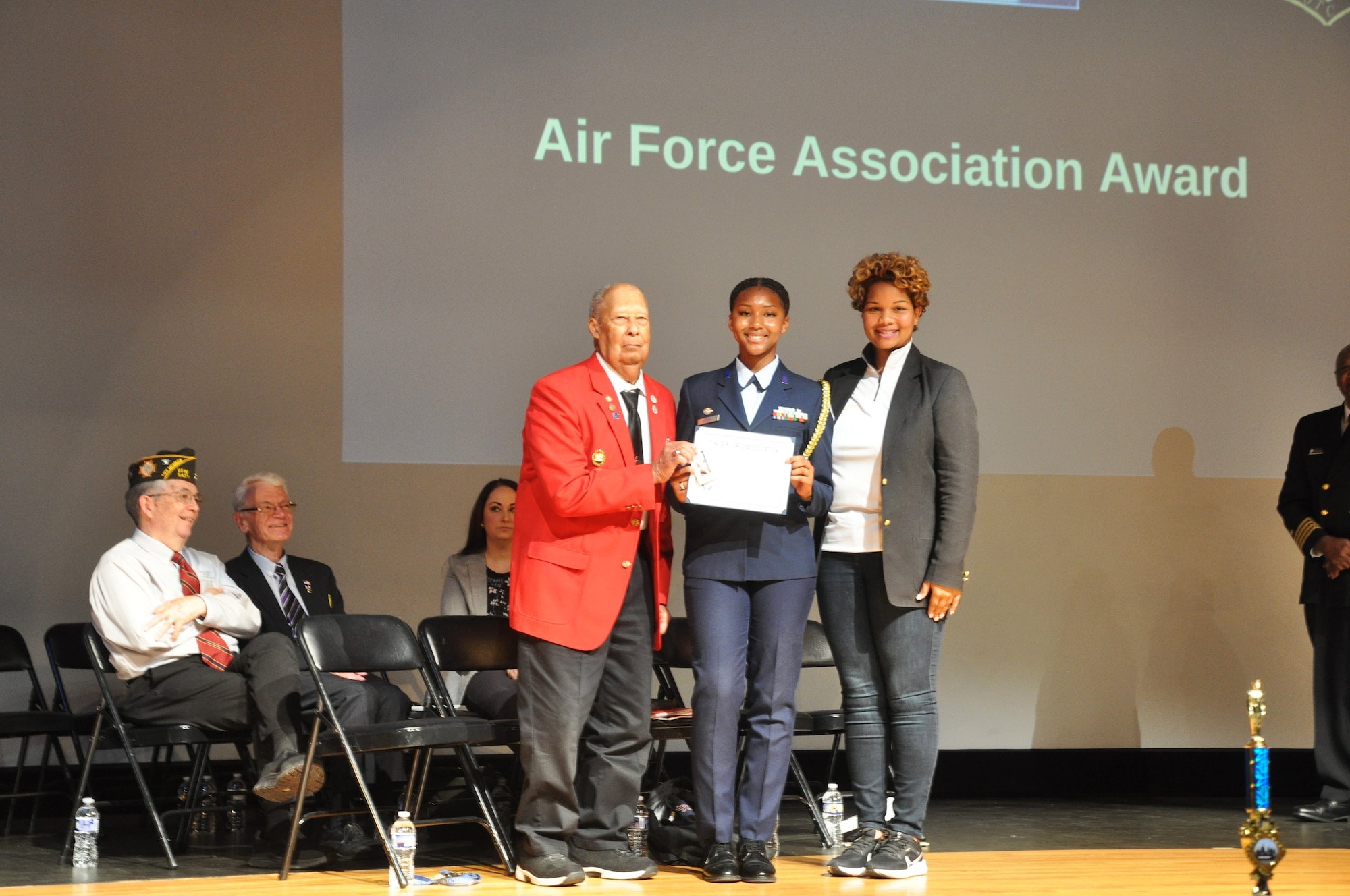 Cadet Aaliyah Jones, center, receives the Air Force Association Award
