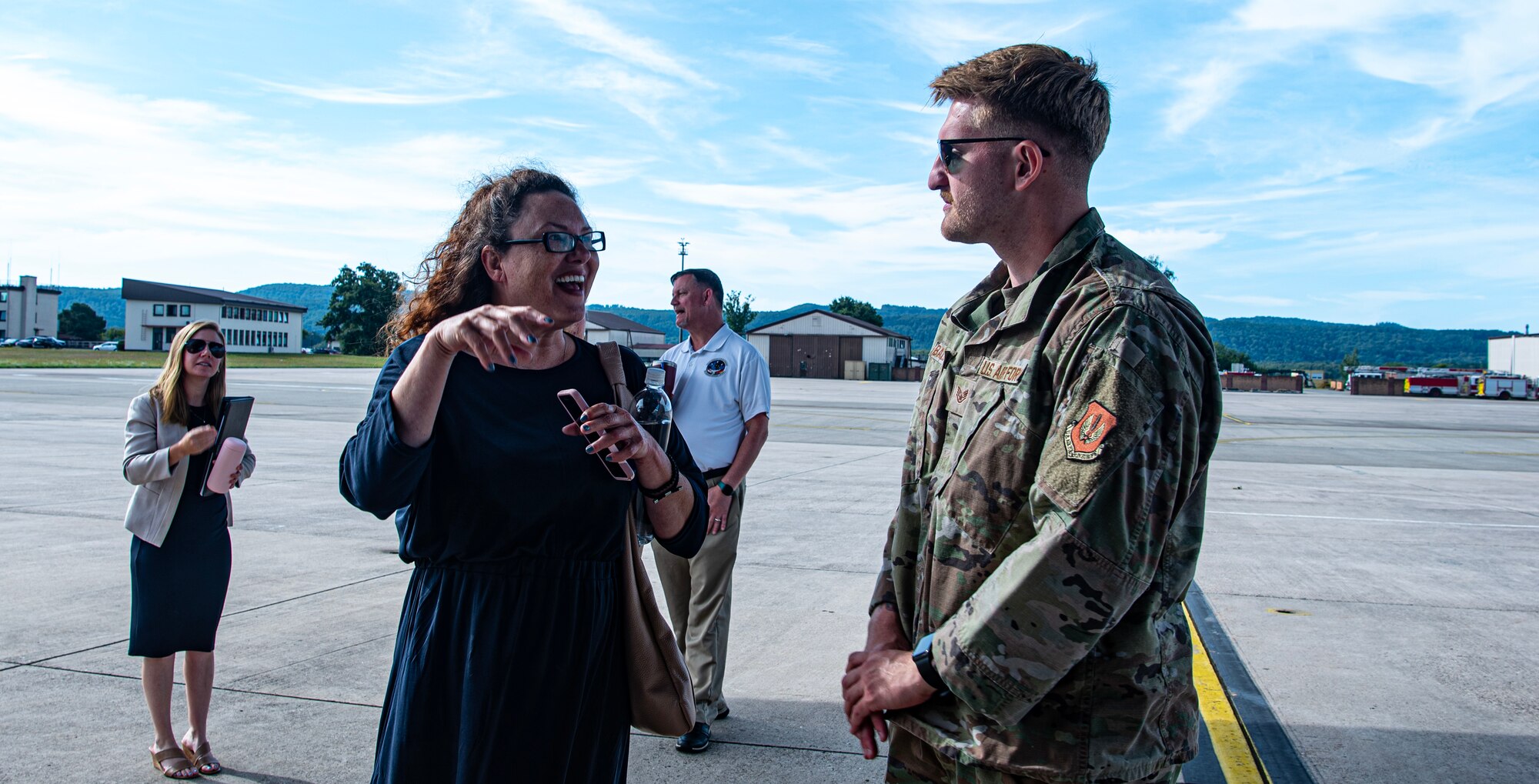 U.S. Air Force Staff Sgt. Sean Ballesteros, 86th Aircraft Maintenance Squadron crew chief, talks to Catherine Poweska-Russell, Department of Defense Education Activity instructional systems specialist, about the 86th Airlift Wing’s mission at Ramstein Air Base, Germany, Aug. 9, 2024. Ballesteros talked to DODEA educators about how the 86 AW C-130J Hercules aircraft fleet functions and what their operations are to support the Global Gateway. (U.S. Air Force photo by Senior Airman Thomas Karol)