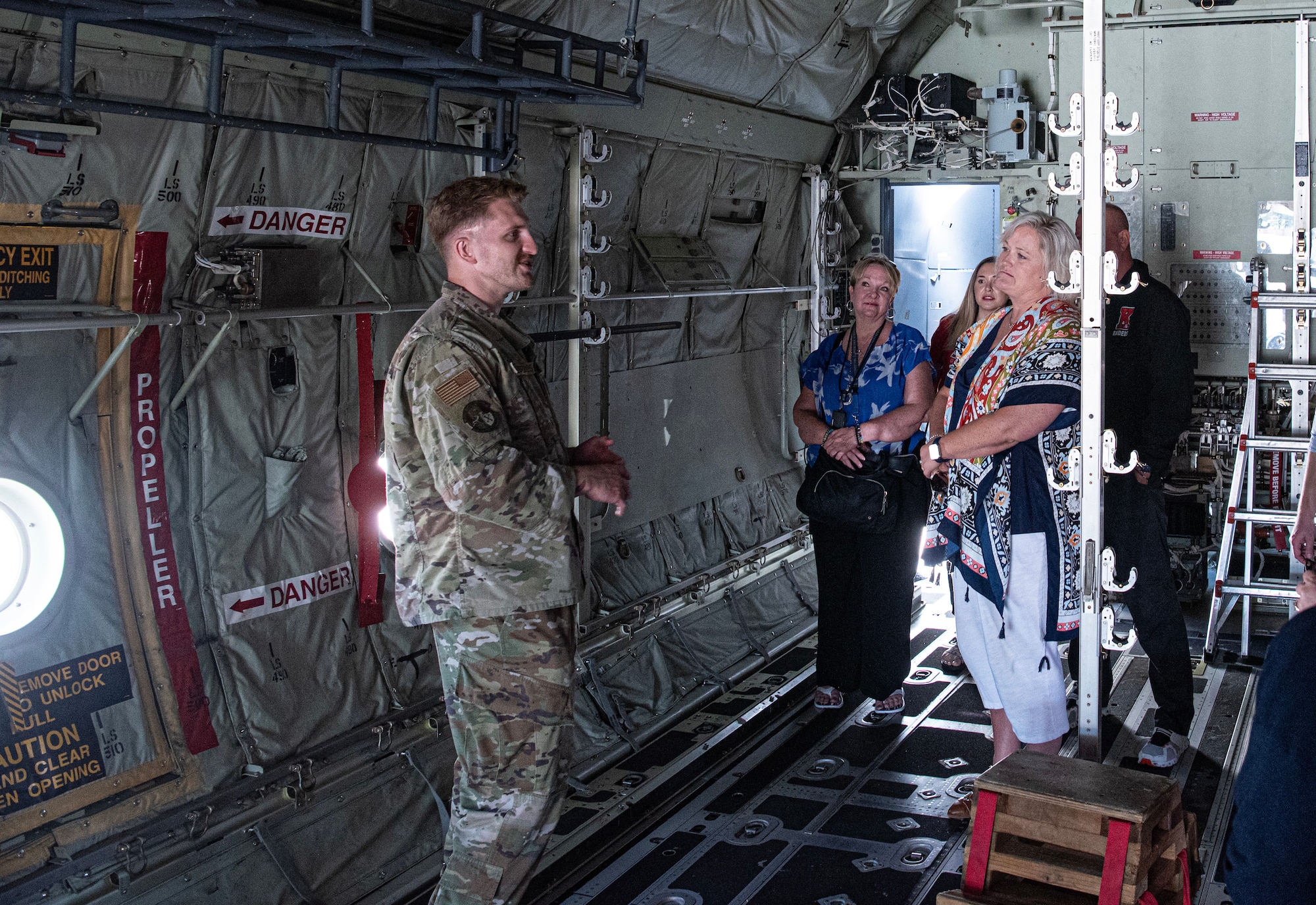 U.S. Air Force Staff Sgt. Sean Ballesteros, 86th Aircraft Maintenance Squadron crew chief, speaks to educators from the Department of Defense Education Activity Europe about a C-130J Hercules Aircraft during an immersion tour at Ramstein Air Base, Germany, Aug. 9, 2024. Ballesteros spoke about the Ramstein AB mission and how critical it is to operations within the European theater. (U.S. Air Force photo by Senior Airman Thomas Karol)