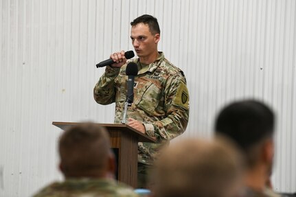 Capt. Jacob Carroll, a plans and operations officer with 297th Regional Support Group, Alaska Army National Guard, welcomes Soldiers from 2nd Battalion, 300th Field Artillery, Wyoming Army National Guard, with an exercise in-brief during Mobilization Exercise III at Camp Funston on Fort Riley, Kansas, Aug. 2, 2024. MOBEX III is the continuing effort of rapidly mobilizing forces during large-scale mobilization operations.