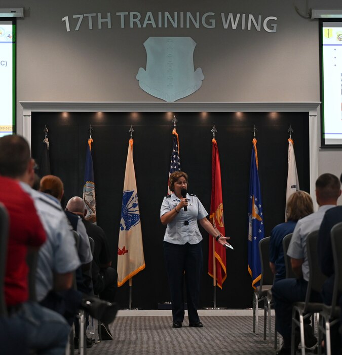 U.S. Air Force Col. Angelina Maguinness, 17th Training Wing commander, addresses the crowd during the 17th Training Wing 2nd Quarterly Commanders Call at the Powell Event Center, Goodfellow Air Force Base, Texas, Aug. 9, 2024. One of Maguinness’ goals is to look past a right-now mindset and further into the 17th TRW and the Airmen that come after. (U.S. Air Force photo by Airman 1st Class Madi Collier)