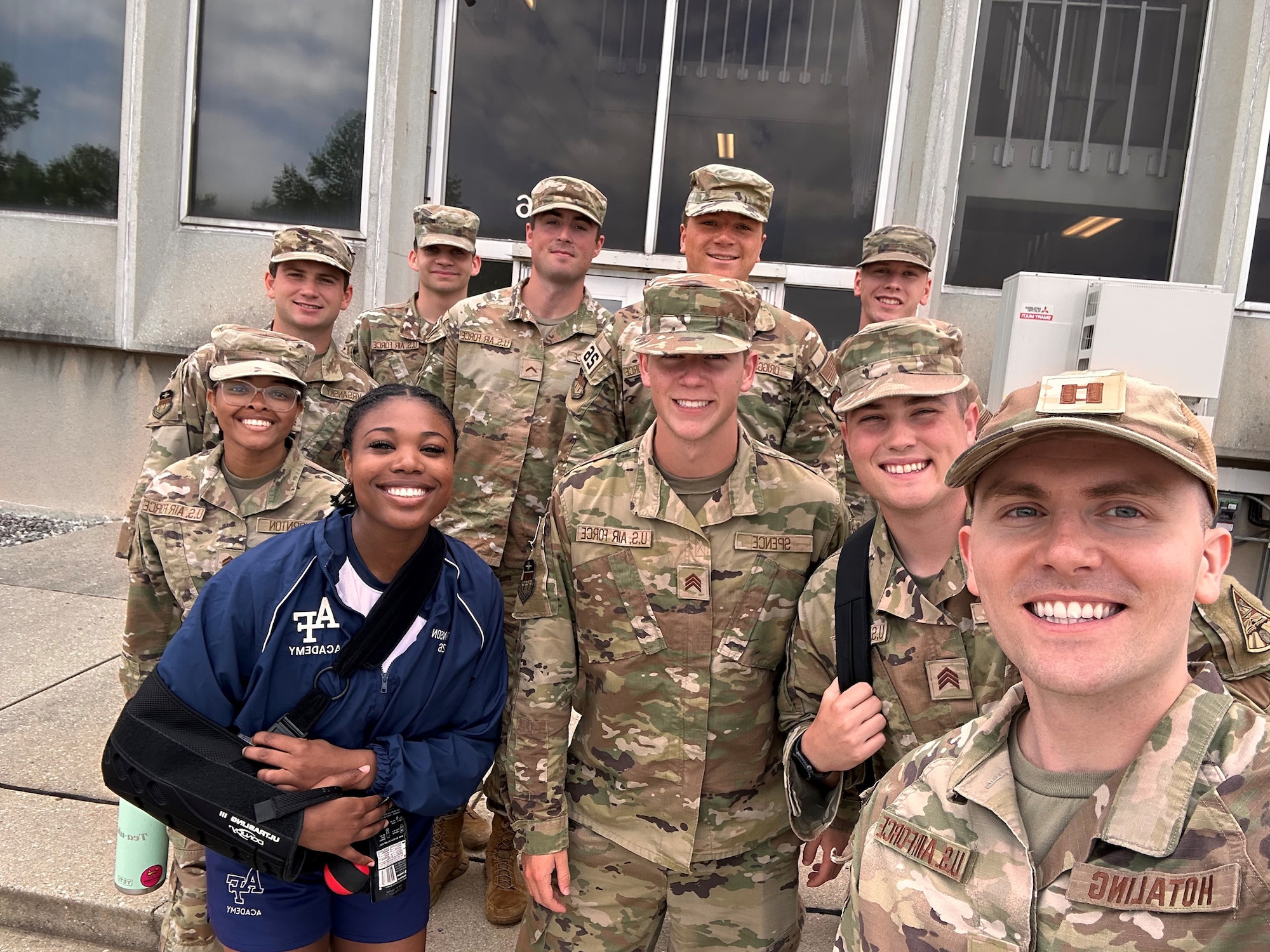 Capt. James Hotaling, 655th Intelligence, Surveillance and Reconnaissance (ISR) Wing executive officer, (right) escorts a group of Air Force Academy and Reserve Officer Training Corps (ROTC) cadets around Wright Patterson Air Force Base during their visit to the wing on June 14, 2024. The cadets visited both the 655th ISR Wing and the 445th Airlift Wing to learn about the various jobs available and what work days would look like. (U.S. Air Force Photo by Capt. James Hotaling)