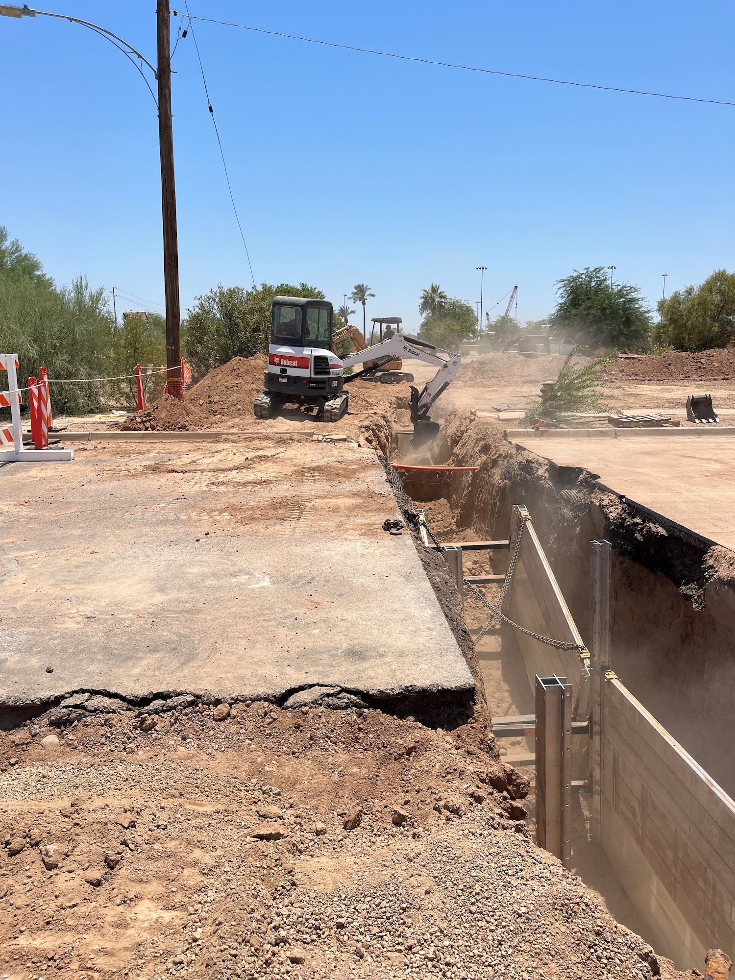 U.S. Air Force Airmen assigned to the 56th Civil Engineer Squadron carve out a trench during a renovation of the base gym and chapel heating, ventilation, and air conditioning systems, at Luke Air Force Base, Arizona.
