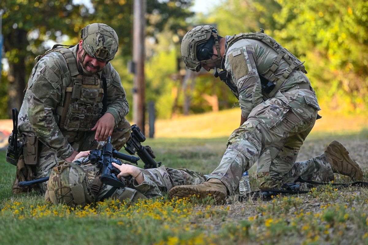 A member from the 19th Security Forces Squadron performs Tactical Combat Casualty Care on a team member during a locally developed, 30-day training program at Little Rock Air Force Base, Arkansas, Aug. 9, 2024. The purpose of the training program is to reinforce the fundamentals of air base ground defense and prepare Airmen for missions they don’t typically encounter daily.