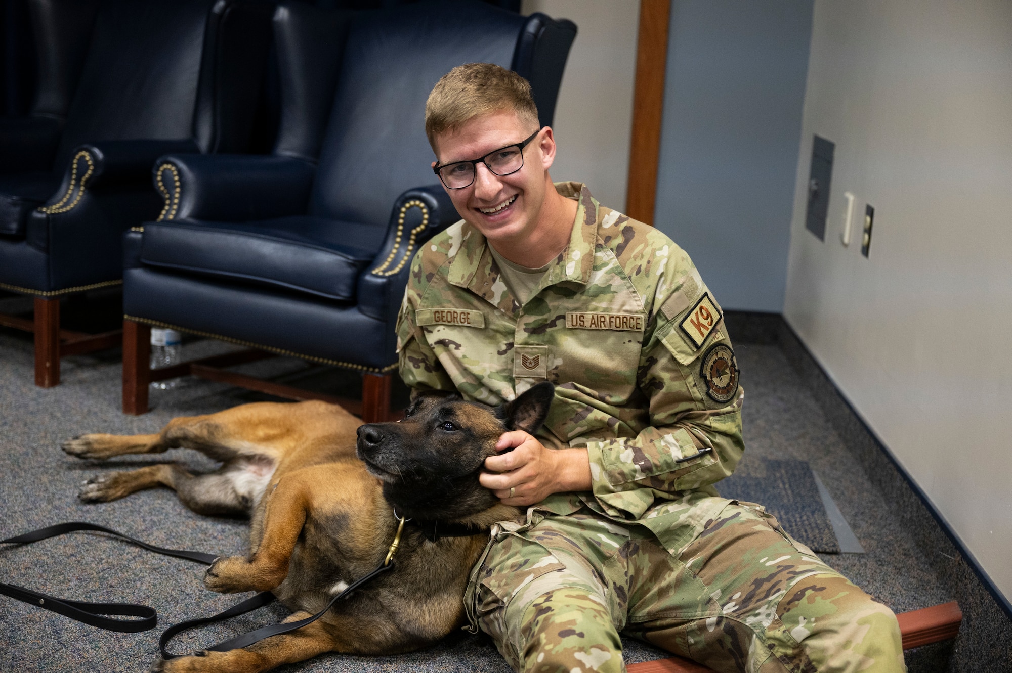 A dog plays with a man.