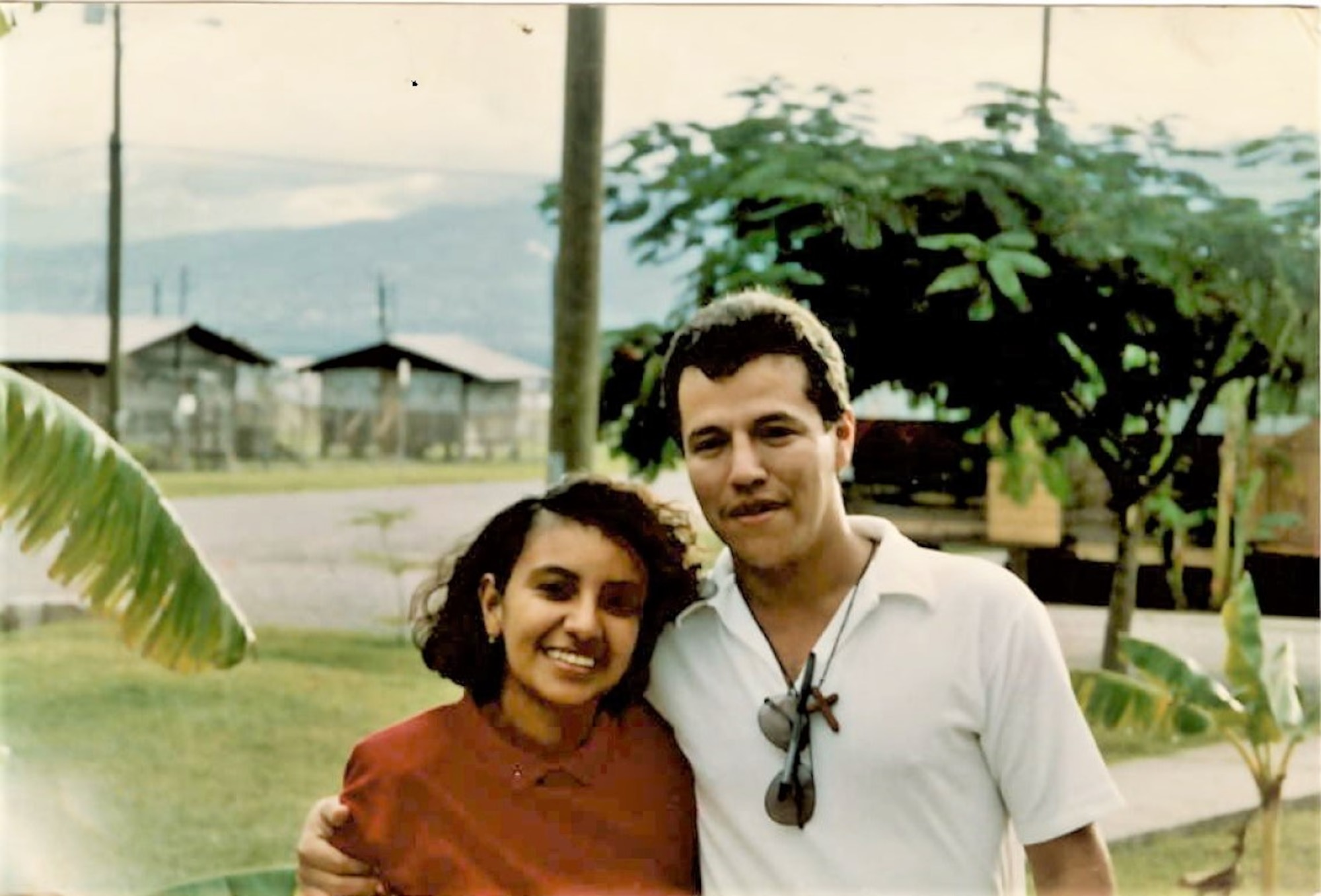 A photo of two people posing for a picture.