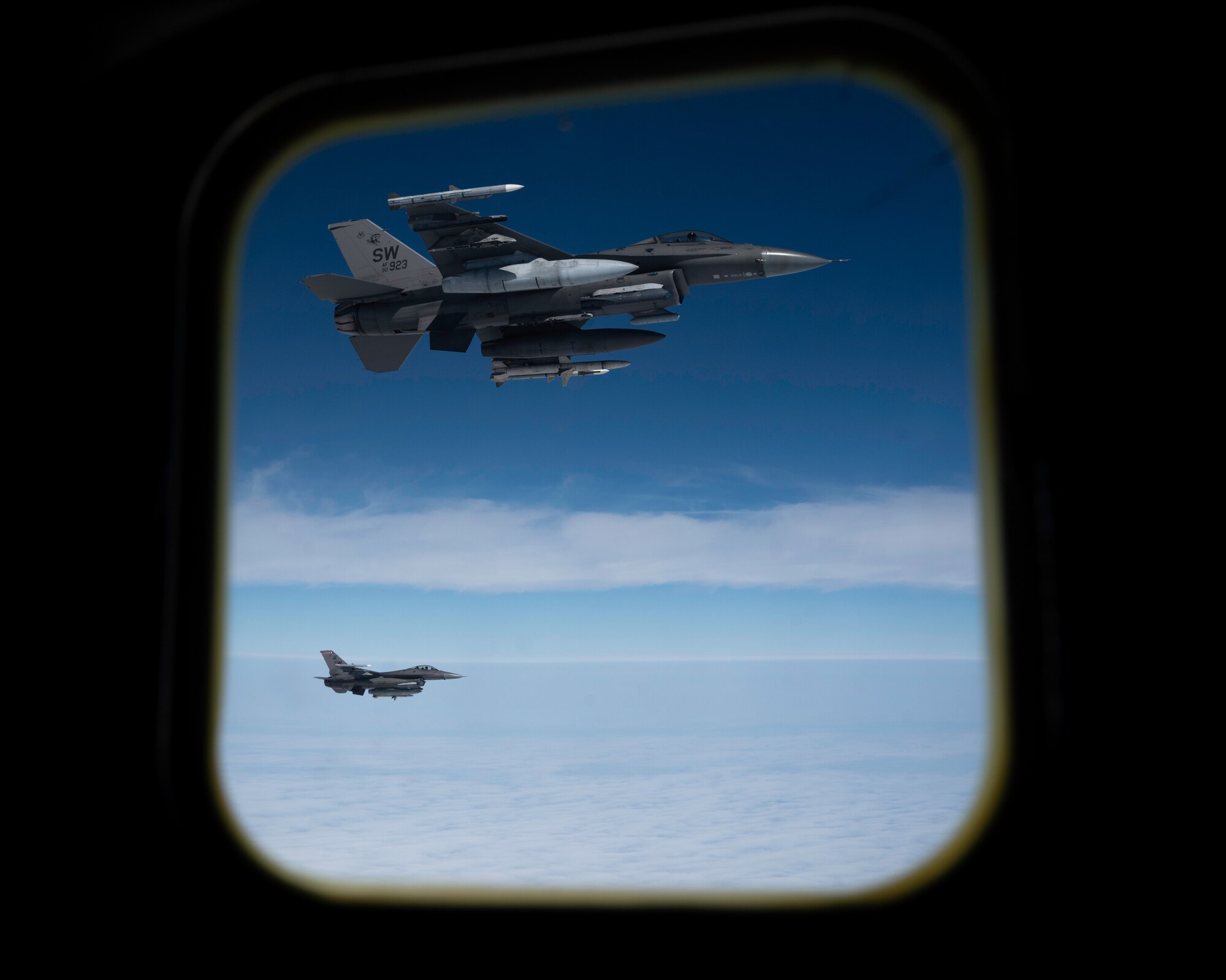 Two U.S. Air Force F-16 Fighting Falcons assigned to the 92nd Fighter Squadron, Shaw Air Force Base, South Carolina, fly alongside a KC-135 Stratotanker assigned to the 91st Air Refueling Squadron over the western United States during Exercise Bamboo Eagle 24-3, Aug. 5, 2024. Through employment of the KC-135 aircraft, the 91st ARS extends U.S. global power and global reach by planning and executing aerial refueling missions for U.S. and allied combat and support aircraft. During Bamboo Eagle, Air Mobility Command assets will support warfighters implementing all-domain combat-power generation from disaggregated basing locations throughout the western part of the U.S., along with distributed command and control, agile logistics, and tactical air-to-air refueling. Bamboo Eagle provides participating units opportunities to reoptimizing for Great Power competition and to focus on mission readiness by to deliver cross-functional and lethal combat capabilities with the speed and agility required to meet pacing challenges. (U.S. Air Force photo by Tech. Sgt. Alexander Cook)