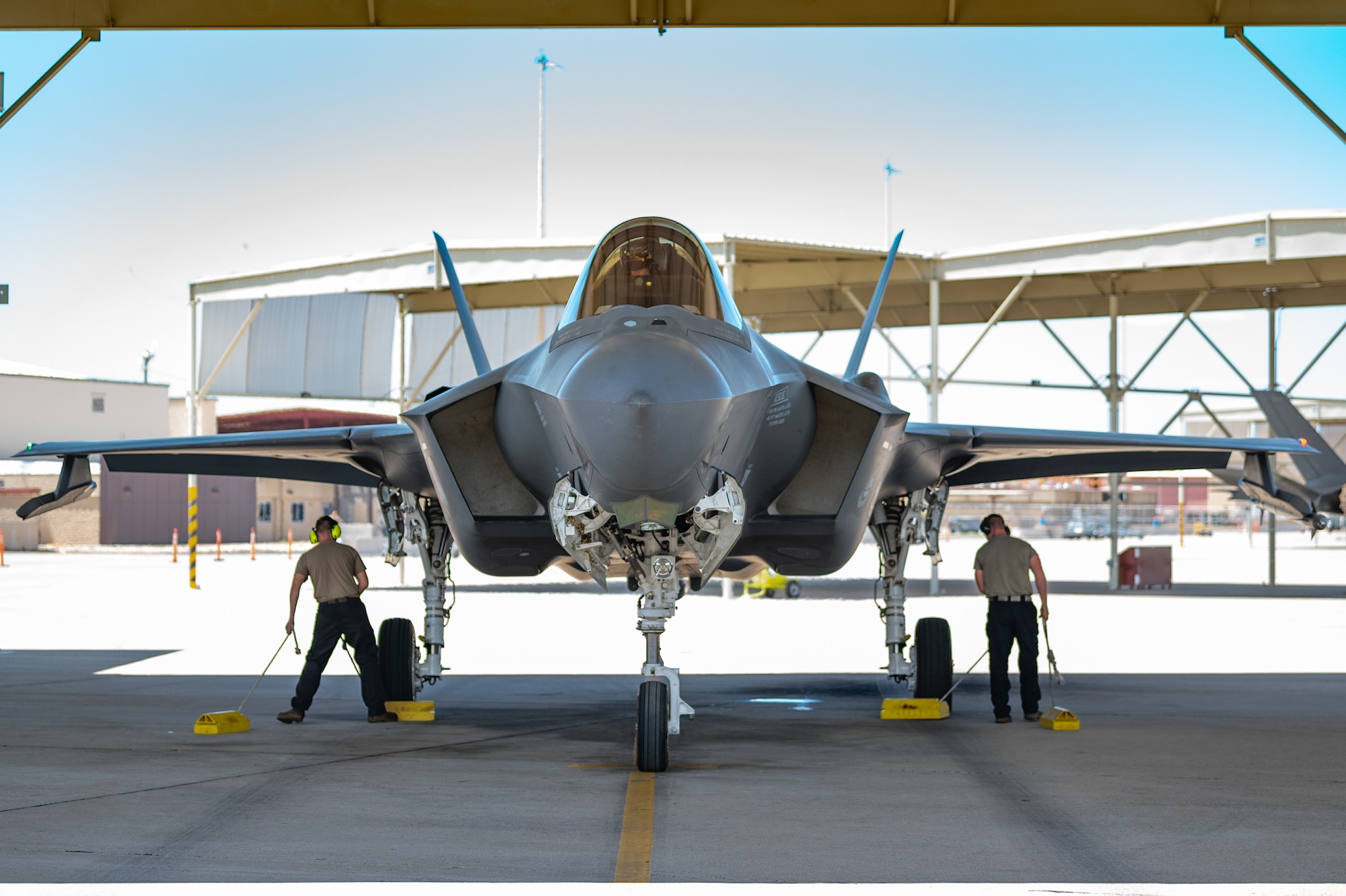 Reserve Citizen Airman Lt. Col. Christopher "Lube" Lowe, F-35 instructor pilot, prepares to exit an F-35 Lightning II at Luke Air Force Base, Ariz., after achieving 1,000 flight hours in the aircraft, Aug. 9, 2024. Lowe's achievement highlights the collaboration and effort of the many Airmen who contribute to each flight. (U.S. Air Force photo by Tech. Sgt. Tyler J. Bolken)
