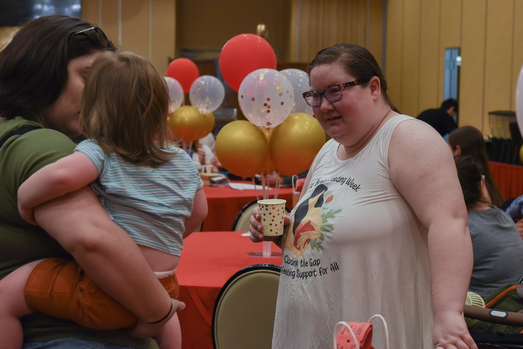 Mandy Wagnild, 35th Surgical Operations Squadron lactation specialist, interacts with a mother and her baby during the World Breastfeeding Week support event support event at Misawa Air Base, Japan, Aug. 3, 2024.