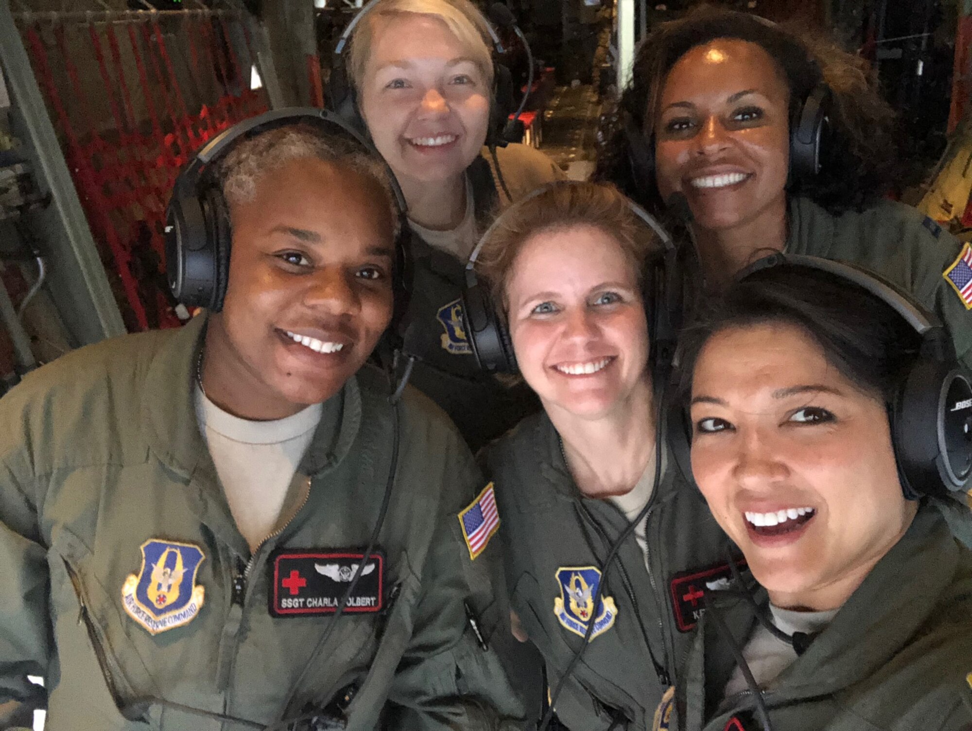 MSgt Cynthia Webster, right, poses with other members of the 908th Aeromedical Evacuation Squadron.