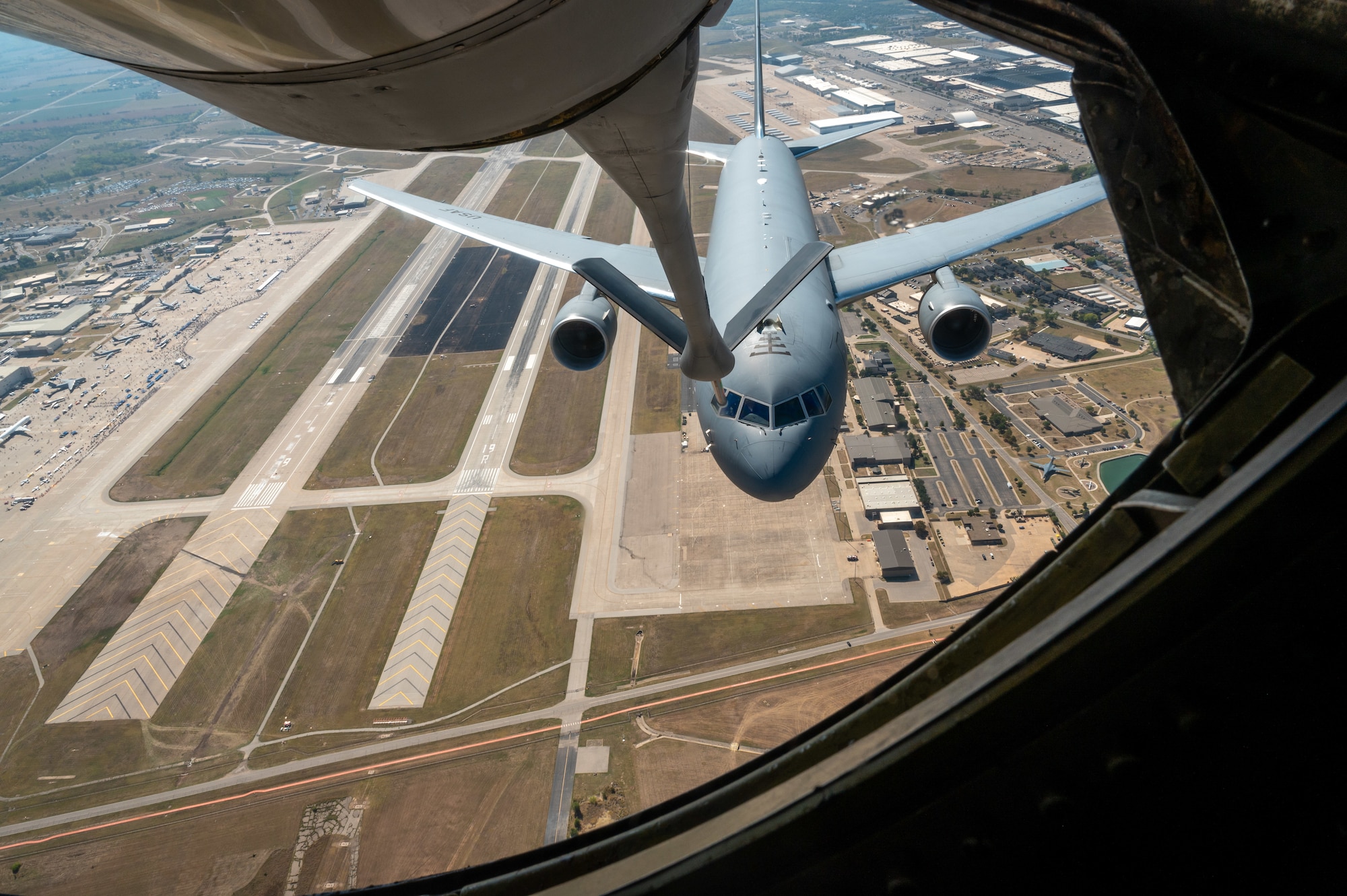 McConnell's KC-135 Stratrotanker and KC-46A Pegasus kick off the start of the Frontiers in Flight Airshow with an aerial refueling demonstration Sep. 25, 2022, at McConnell Air Force Base, Kansas. This airshow is Team McConnell's way of saying thanks to the people of Wichita and its surrounding area. (U.S. Air Force photo by Senior Airman Zachary Willis)