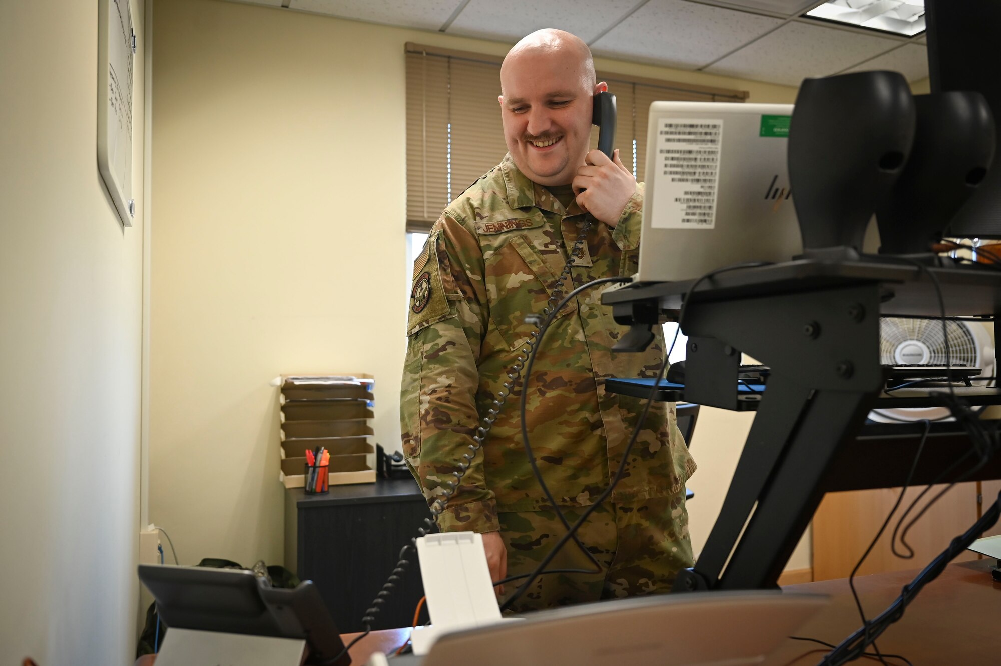 U.S. Air Force Tech. Sgt. Aaron Jennings, 8th Operations Support Squadron noncommissioned officer in charge of current operations flight, coordinates scheduling on the phone.
