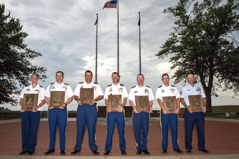 The All National Guard Rifle Team poses for a group photo after winning the National Trophy also known as the Dogs of War Trophy, during the National Matches at Camp Perry, Ohio, Aug. 2, 2024. This is the third time that the national guard won the National Trophy since its inception in 1903, the last time being in 1986 and 1977. (U.S. Air National Guard photo by Senior Master Sgt. Shawn Monk)