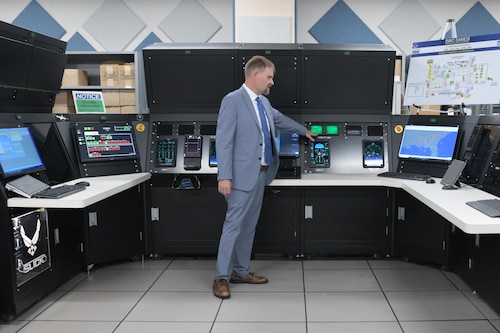 Man standing at monitor
