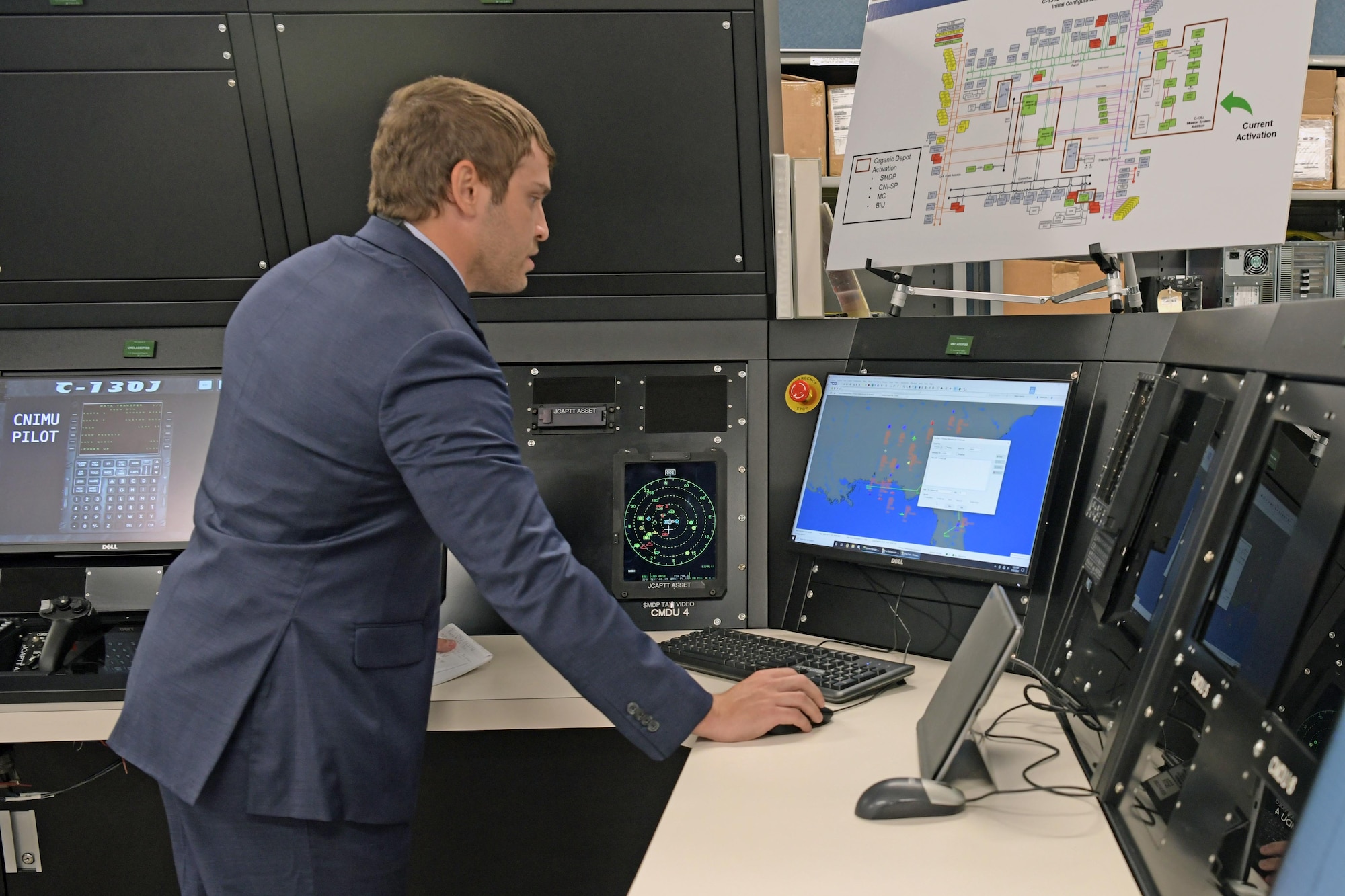 Man standing at monitor