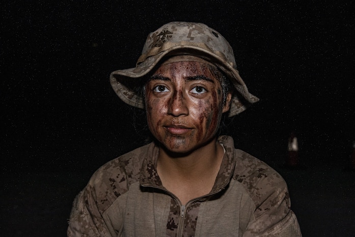 U.S. Marine Corps recruit with Alpha Company, 1st Recruit Training Battalion, takes a break during a rest period while executing the 15-kilometer hike as the final portion of the Crucible on Marine Corps Base Camp Pendleton, California, July 31, 2024. The Crucible is a 54-hour event where recruits apply the knowledge they have learned throughout recruit training, to earn the title of United States Marine. (U.S. Marine Corps photo by Cpl. Sarah M. Grawcock)