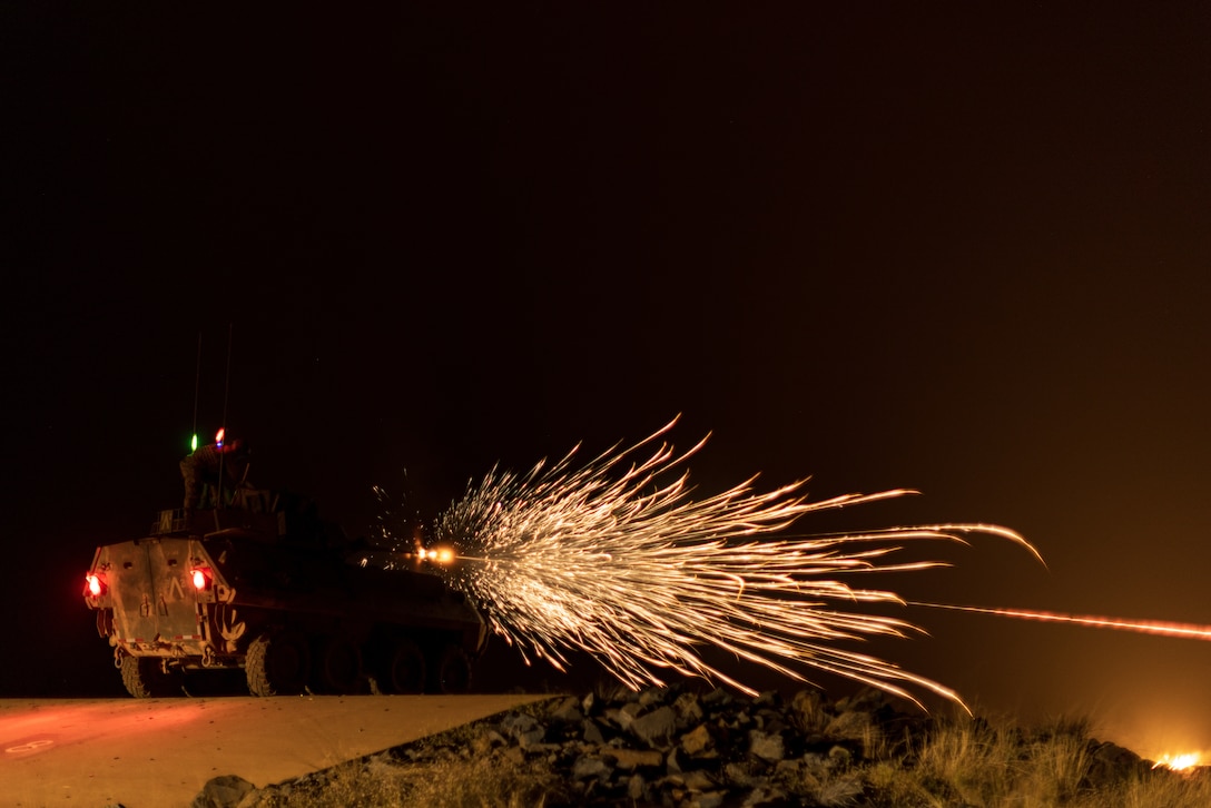 U.S. Marines with Alpha Company, 1st Light Armored Reconnaissance Battalion, 1st Marine Division, fire the M242 Bushmaster chain gun of an LAV-25 Light Armored Vehicle during a live-fire range as a part of Exercise Predator’s Run 24 at Mount Bundey Training Area, NT, Australia, July 28, 2024. During Rapid Deployment Exercise, 1st LAR rapidly deployed from Marine Corps Base Camp Pendleton, California, U.S., to Australia by strategic lift and rail to participate in the 1st Brigade, Australian Army led, Exercise Predator’s Run 24. Exercise Predator’s run 24 provides Marine Rotational Force – Darwin 24.3 reinforced by 1st LAR, the opportunity to conduct training missions as a Marine Air Ground Task Force, while integrating command and control, aviation, logistics, off-continent and Allied capabilities to increase security and stability in the Indo-Pacific Region. (U.S. Marine Corps photo by Cpl. Earik Barton)