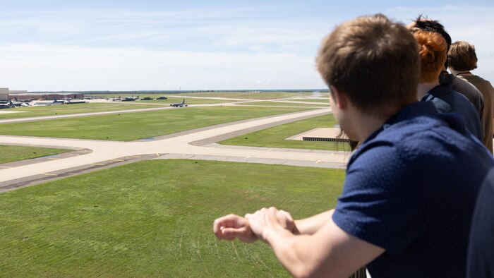People looking out over airfield
