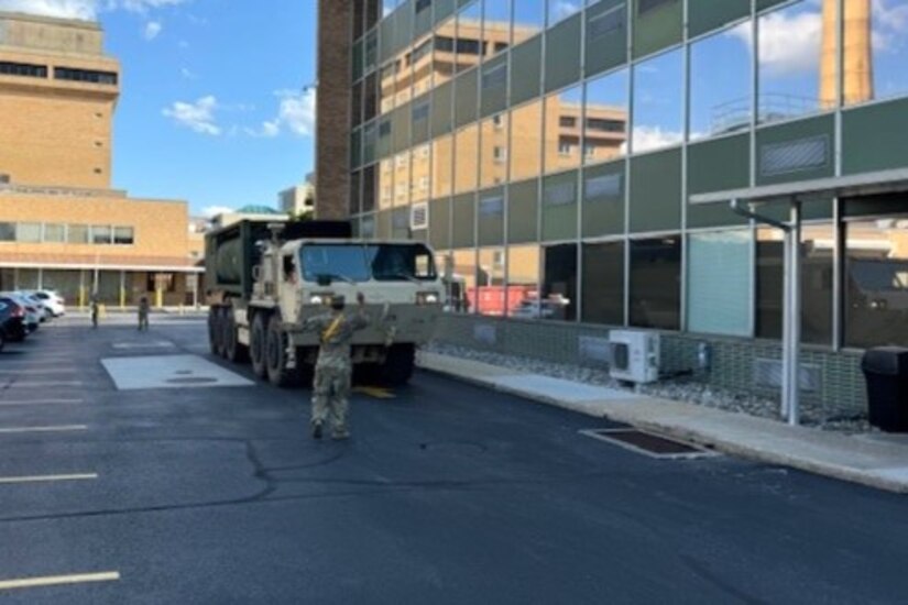Soldiers with the 628th Aviation Support Battalion, 28th Expeditionary Combat Aviation Brigade, 28th Infantry Division provide potable water to Penn State Health Holy Spirit Medical Center at Camp Hill, Pennsylvania, Aug. 10, 2024. An emergency water advisory affected nearly 42000 customers in that part of the commonwealth and these Soldiers responded to a call from the Pennsylvania Emergency Management Agency for the Pennsylvania National Guard to assist. (Courtesy Photo)