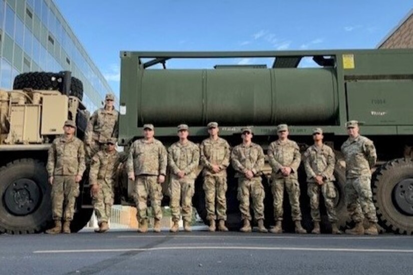 From left, U.S. Army Spc. Nathan Ortiz, Sgt. 1st Class Lisa Geer, Sgt. 1st Class Howard Briddelle, Maj. Shawn Updegrove, Sgt. Quentin Barrick, 1st Lt. Cullen McElligott, Sgt. Matthew Johnson, Pfc. Malori Francis, Spc. Andrew Getz and Sgt. 1st Class Jeffrey Hunsicker, assigned to the the 628th Aviation Support Battalion, 28th Expeditionary Combat Aviation Brigade, 28th Infantry Division provide potable water to Penn State Health Holy Spirit Medical Center at Camp Hill, Pennsylvania, Aug. 10, 2024. An emergency water advisory affected nearly 42000 customers in that part of the commonwealth and these Soldiers responded to a call from the Pennsylvania Emergency Management Agency for the Pennsylvania National Guard to assist. (Courtesy Photo)