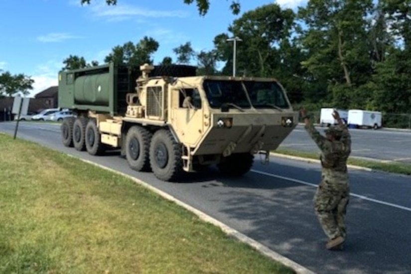 U.S. Soldiers with the 628th Aviation Support Battalion, 28th Expeditionary Combat Aviation Brigade, 28th Infantry Division drive an M105 Load Handling System Compatible Water Tank Rack, also known as a HIPPO bulk water distribution system, at Fort Indiantown Gap, Pennsylvania, Aug. 10, 2024. Their mission was to provide potable water to Penn State Holy Spirit Medical Center at Camp Hill after an emergency water advisory affected nearly 42000 customers in that part of the commonwealth. These Soldiers responded to a call from the Pennsylvania Emergency Management Agency for the Pennsylvania National Guard to assist. (Courtesy Photo)