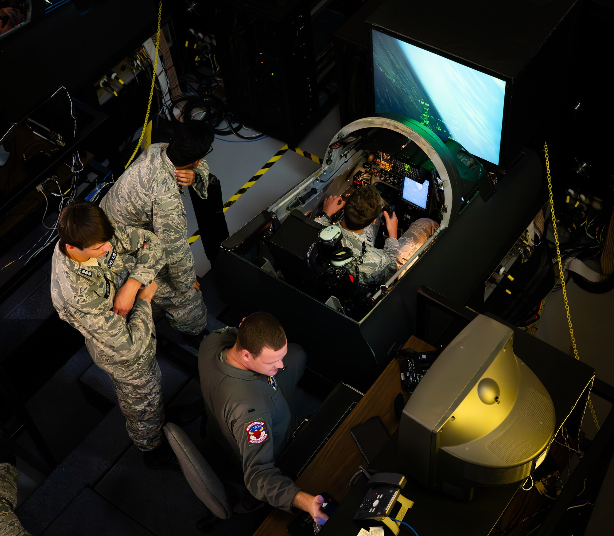 Civil Air Patrol cadets, take turns flying in the T-38C Talon simulators at the flight simulator complex, Laughlin Air Force Base, Aug. 1, 2024. Cadets got to test their flight skills as they performed touch and go landings and aerial maneuvers. (U.S. Air Force photo by Airman 1st Class Harrison Sullivan)