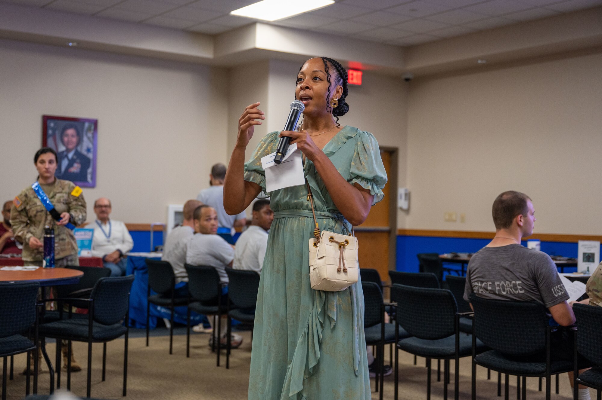 Stephanie Bracely, DRIVE (Develop, Redistribute, Improve, Vault, Expose) program coordinator, kicks off the DRIVE Joint Forces Employment Fast Track event on June 28, 2024 at the Pfingston Reception Center on Joint Base San Antonio-Lackland.