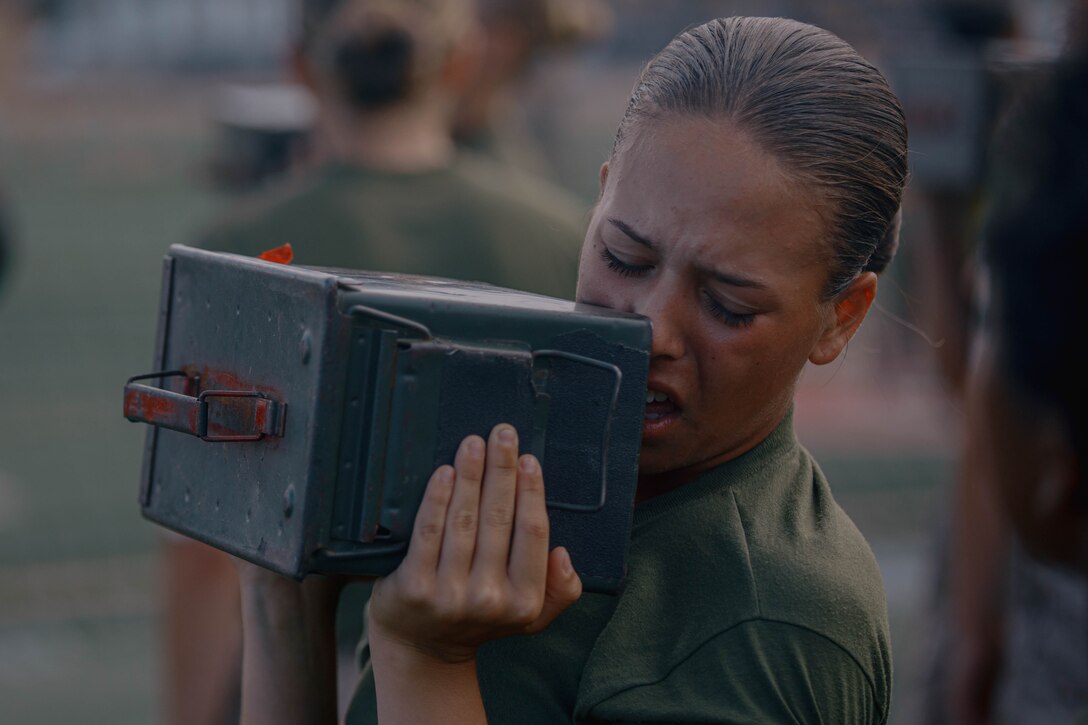 U.S. Marine Corps Recruit Enae Veldares, a recruit with Fox Company, 2nd Recruit Training Battalion, conducts the ammunition can lift portion of a combat fitness test at Marine Corps Recruit Depot San Diego, California, Aug. 1, 2024. The CFT is an annual fitness test that is required of all Marines to pass and maintain consisting of an 880-yard sprint, ammunition can lifts, and a maneuver under fire drill. Veldares was recruited out of Recruiting Station Amarillo, Texas.(U.S. Marine Corps photo by Cpl. Elliott A. Flood-Johnson)
