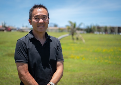 Nam Kim, University of Wisconsin-Madison Department of Anthropology professor, poses for a photo at Andersen AFB, Guam, August 9, 2024. Kim and his family came to Andersen in 1975 as Vietnam War refugees. He visited Andersen to see the location of "Tin City" a refugee camp that housed his family during Operation New Life. (U.S. Air Force photo by Staff Sgt. Pedro Tenorio)